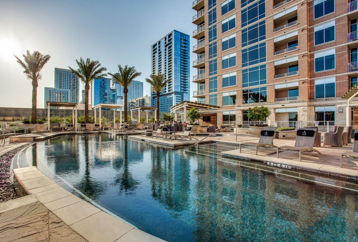 Business professional enjoying luxurious living room in CHC Rentals corporate housing unit in Austin, TX