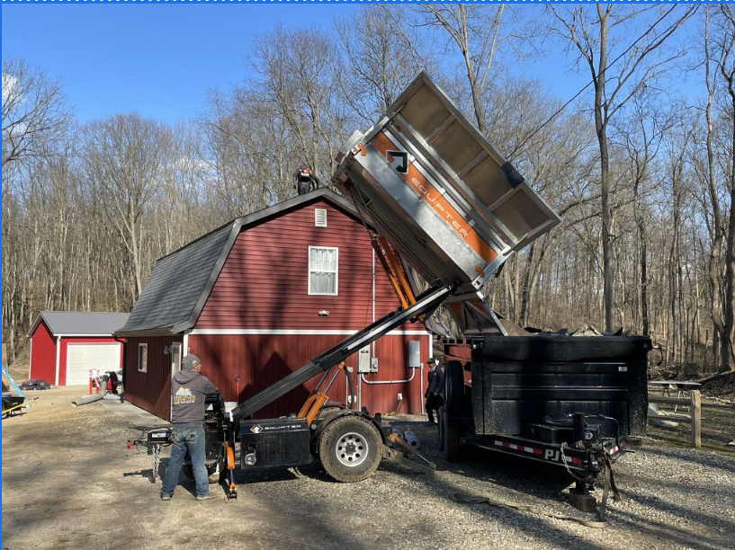 Roof installation project in Galesburg MI with professional team working