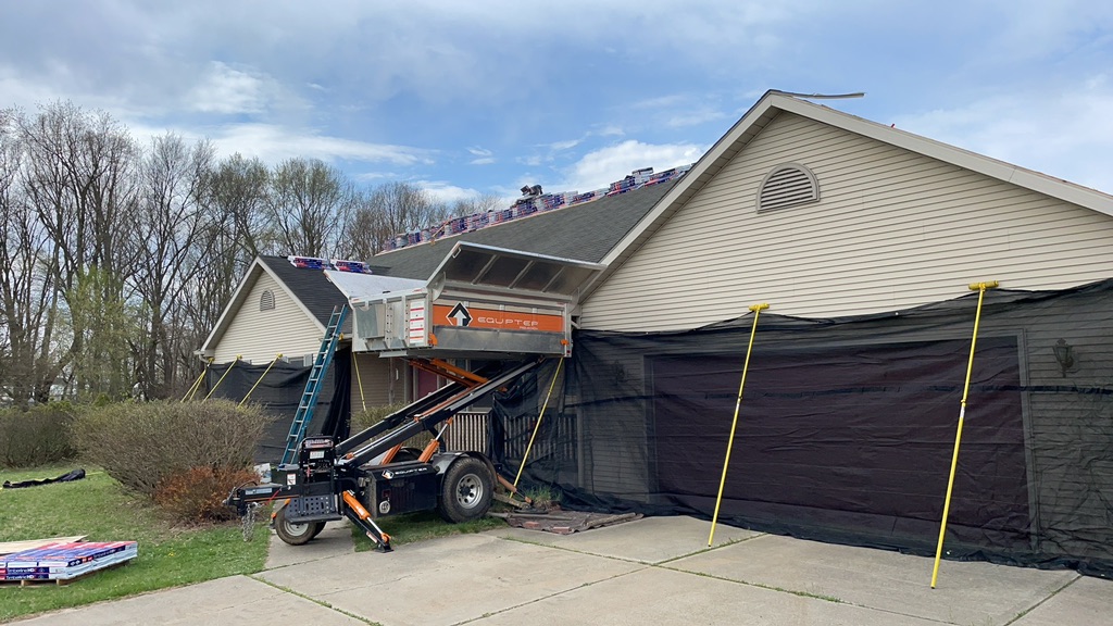 Skilled roofing contractors completing roof installation Portage MI