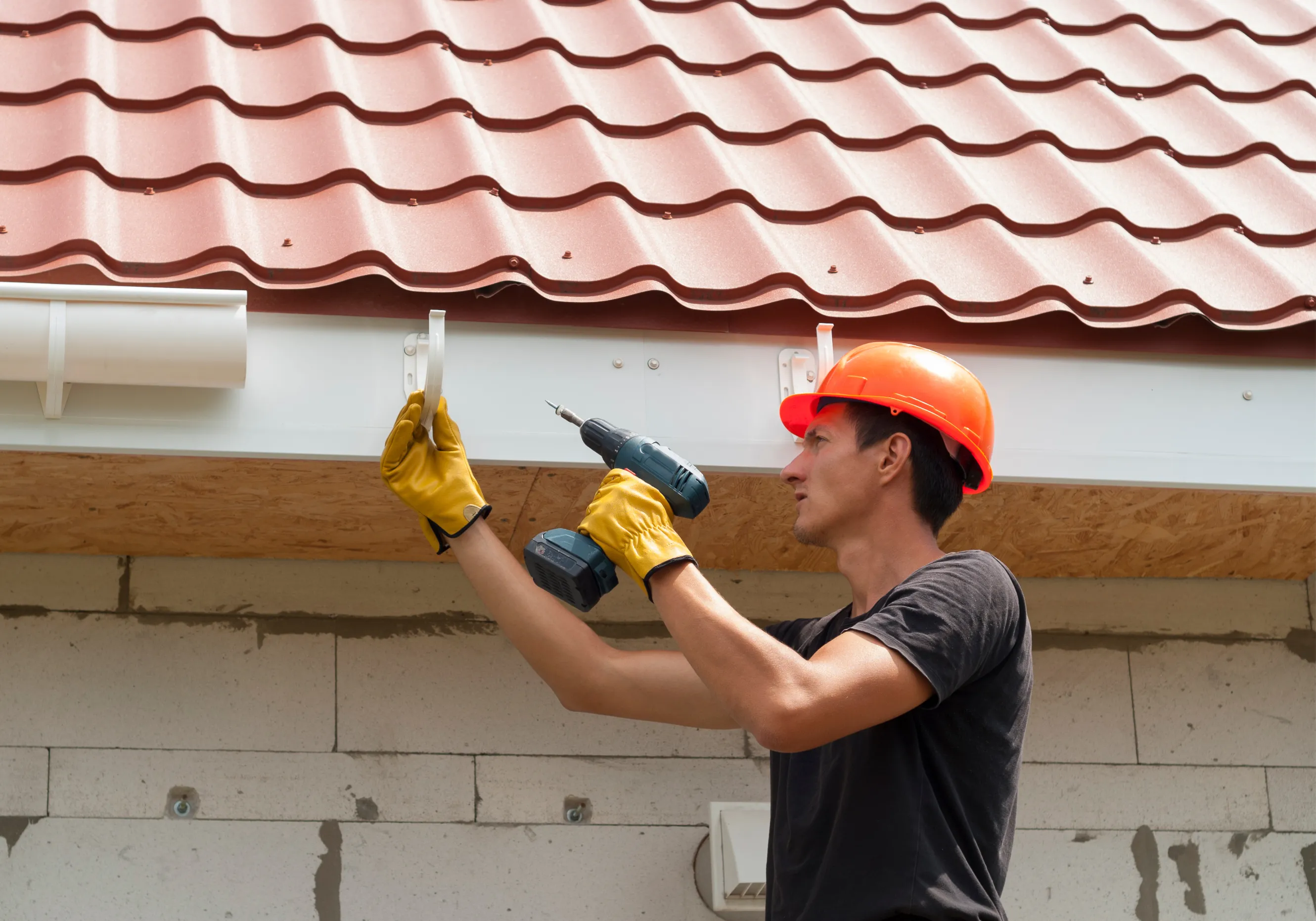 Professional roofer installing shingles on a residential home in Galesburg, MI