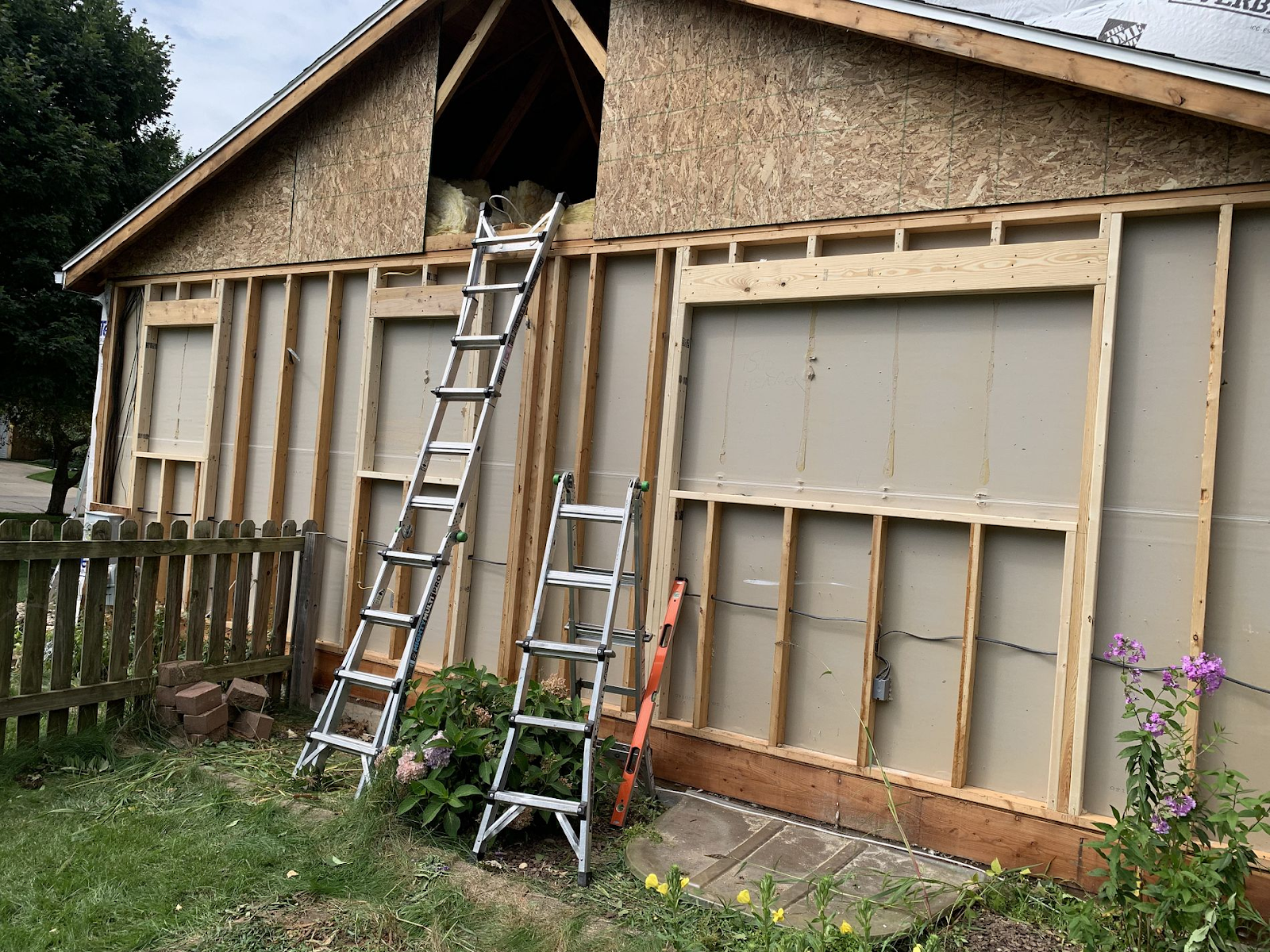 Roof repair team working on residential home in Galesburg, MI